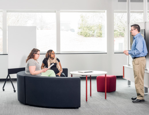 Knoll Interpole with grey k lounge and red Antenna Simple Table for Activity Spaces and other meeting spaces. 